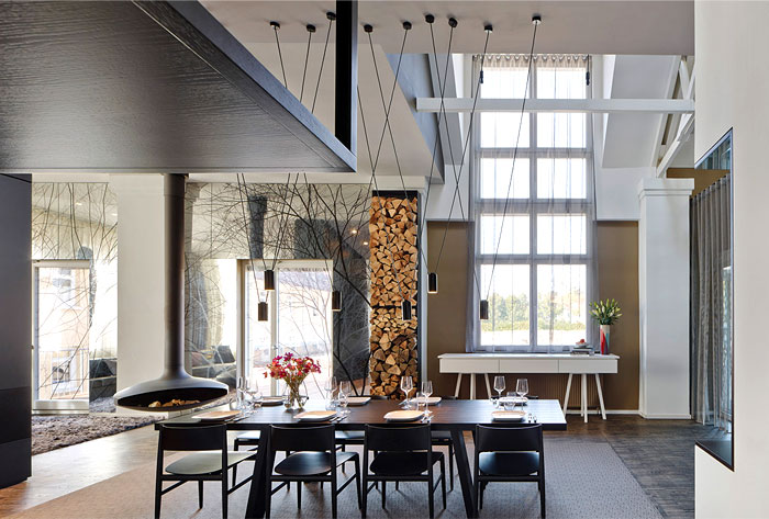 open-spacious-living-space-sculptural-suspended-wood-burning-stove